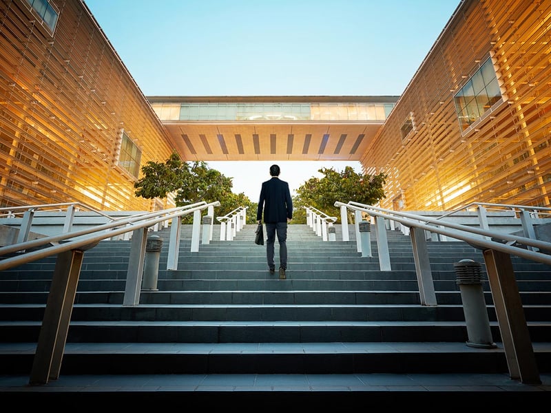 A businessman climbing stairs
