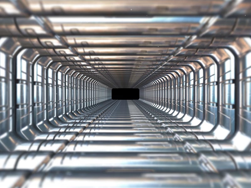 Futuristic metallic tunnel and symmetrical reflections leading to a vanishing point