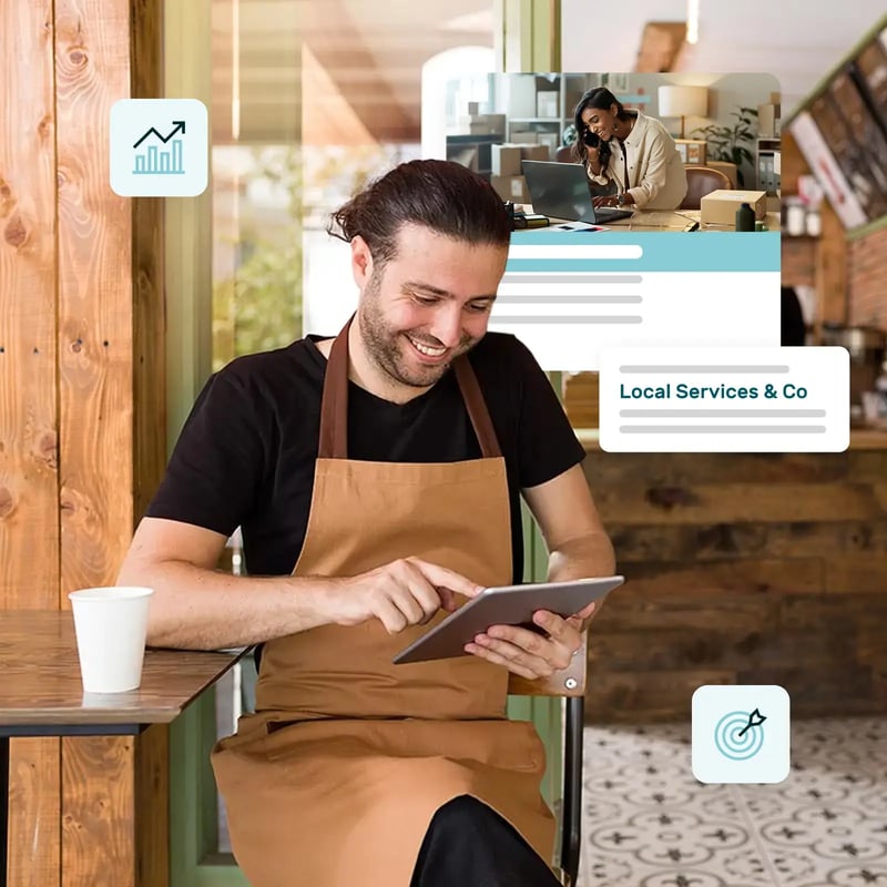Man sitting in a coffee shop looking at a tablet