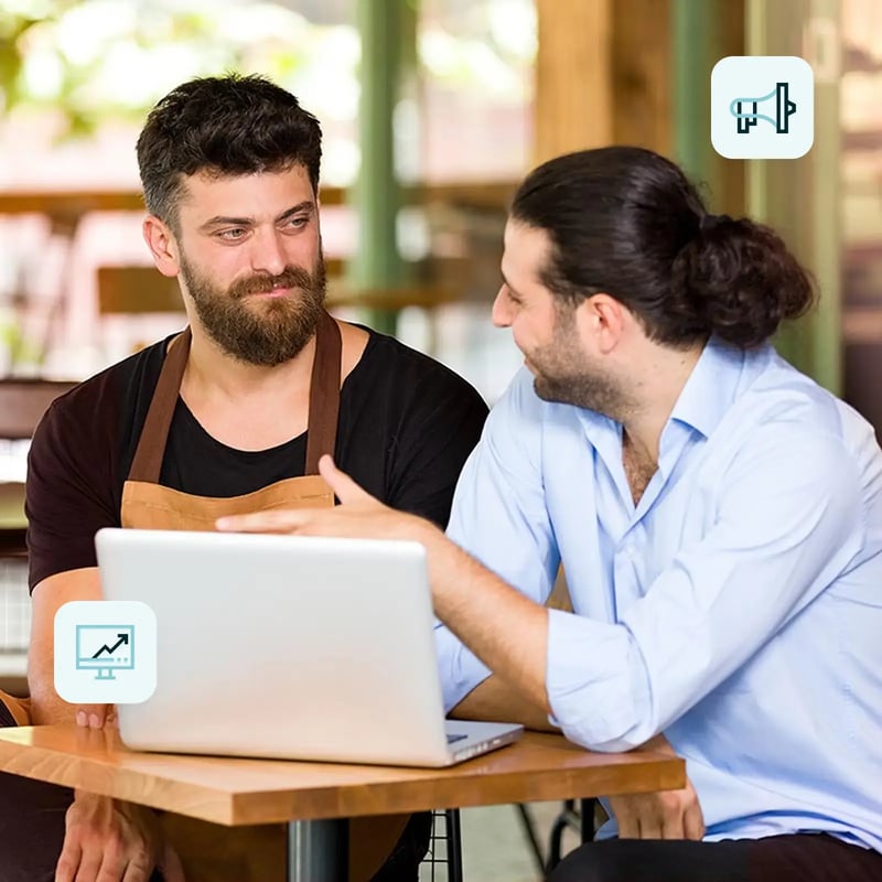 Two men in a meeting at a coffee shop