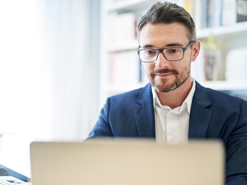 A businessman working at his computer in an office